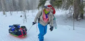 Pulling sled and smiling