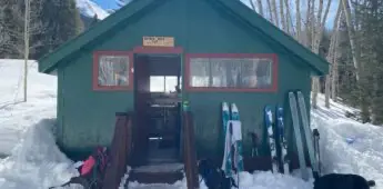 hut front - skis leaning