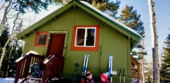 Hut front view, women chatting