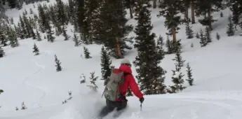 Man on downhill skis