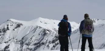 Men on snowy overlook