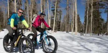 Biking across snow duo